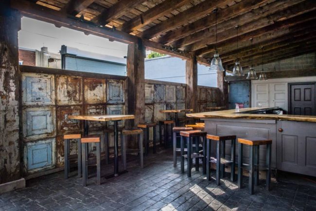 Front Street Cafe features an outdoor dining patio and garden with a secondary bar for the warm weather days.